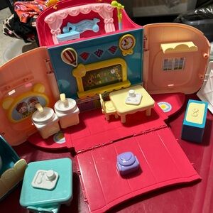 i play. Portable Foldable Pink Playset with Blue and Yellow Accents